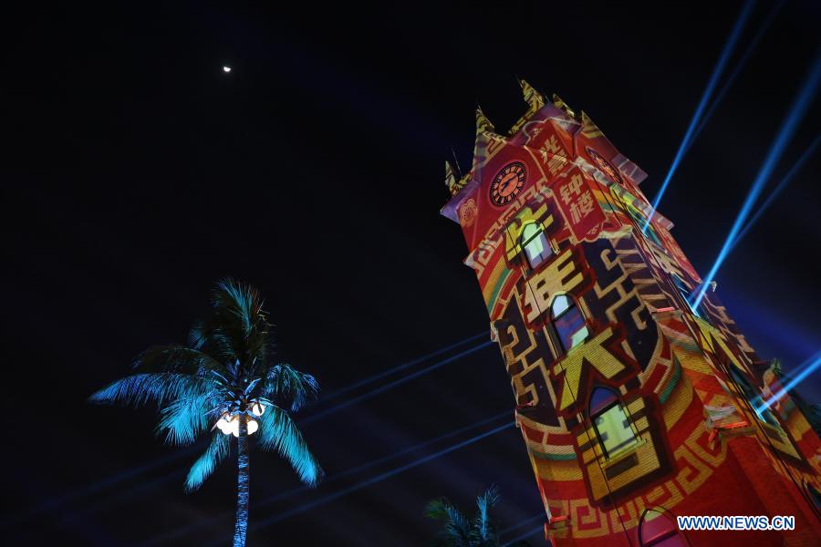 A bell tower is illuminated during a light show in Haikou, south China
