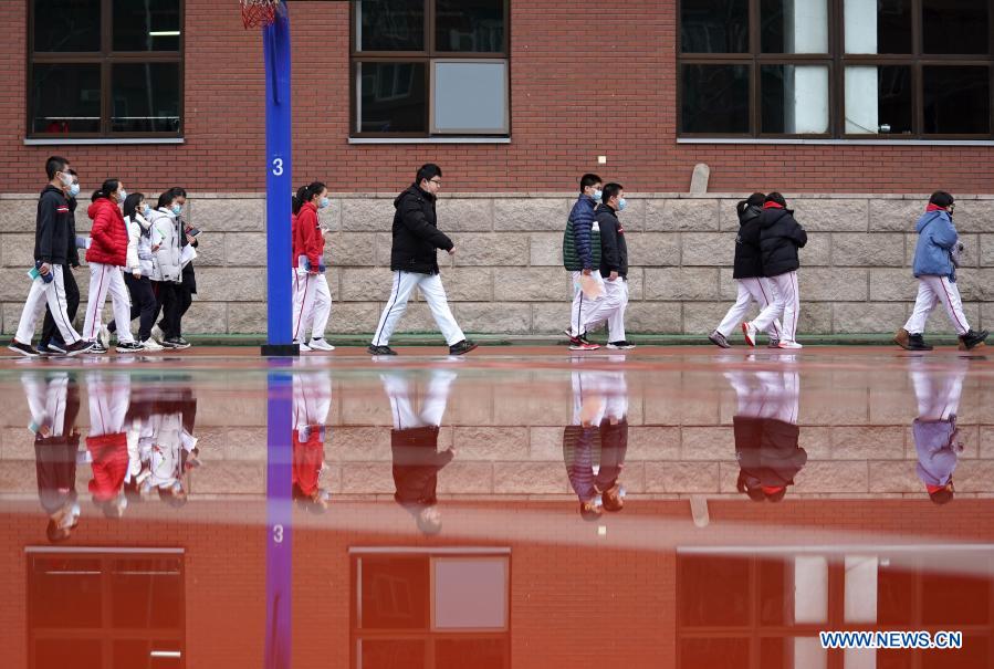 Students walk in the campus at the Experimental High school Attached to Beijing Normal University in Beijing, capital of China, March 1, 2021. Middle school and primary school students returned to school as scheduled for the spring semester in Beijing on Monday amid coordinated epidemic control efforts. (Xinhua/Ju Huanzong) 