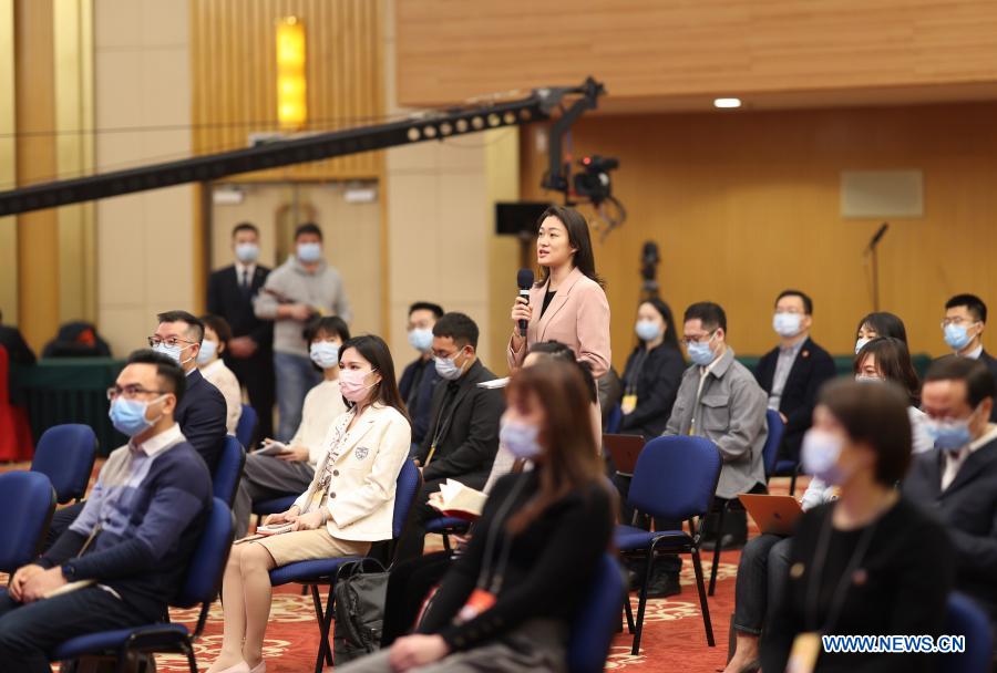 A journalist asks a question during an interview via video link at the Media Center Hotel in Beijing, capital of China, March 5, 2021. Deputies to the 13th National People
