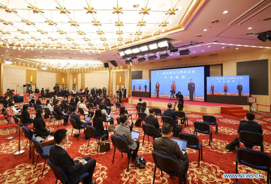 Journalists are seen during an interview via video link at the Media Center Hotel in Beijing, capital of China, March 5, 2021. Deputies to the 13th National People