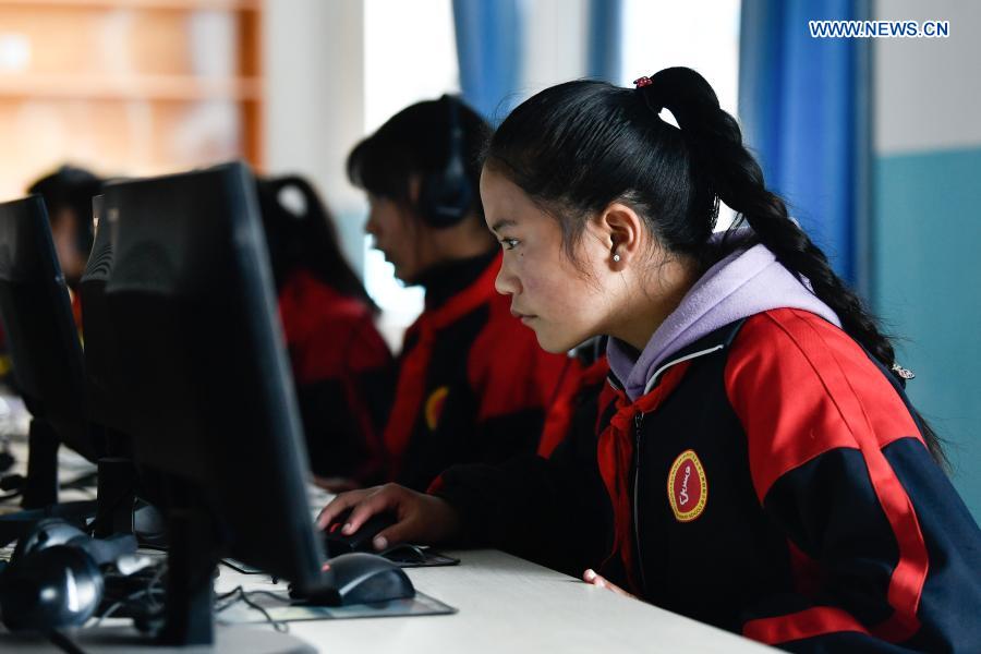 Students have an IT class in a primary school in Gande County of Tibetan Autonomous Prefecture of Golog in northwest China