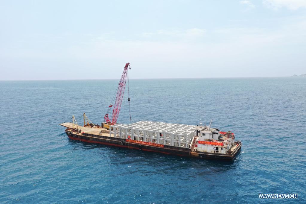 Photo taken on April 8, 2021 shows artificial reefs being placed in Wuzhizhou Island
