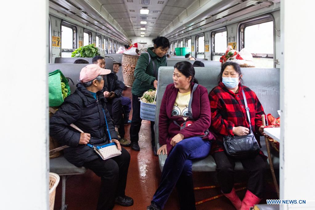 Passengers talk on the train 7266 in central China