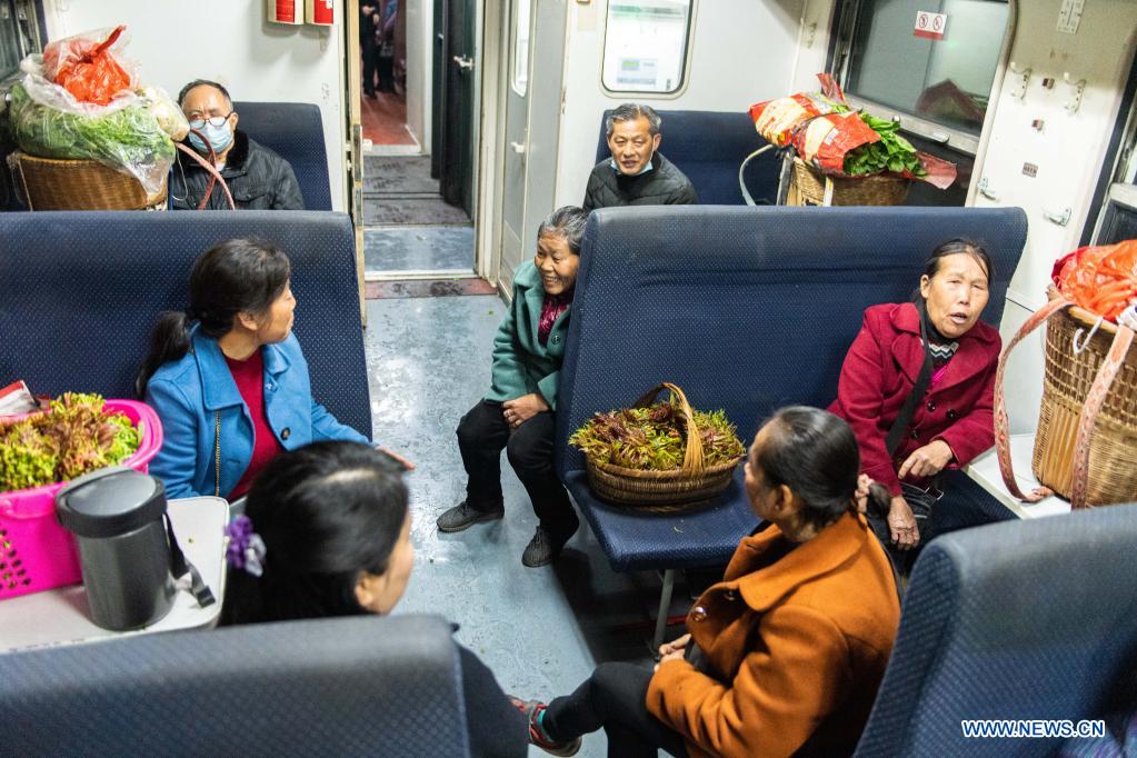 Passengers talk on the train 7266 in central China