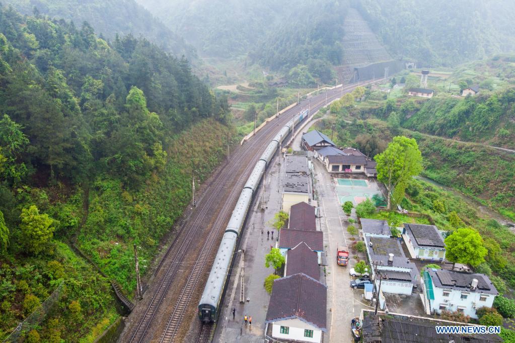 Aerial photo taken on April 11, 2021 shows the train 7266 leaving Wanyan Station in central China